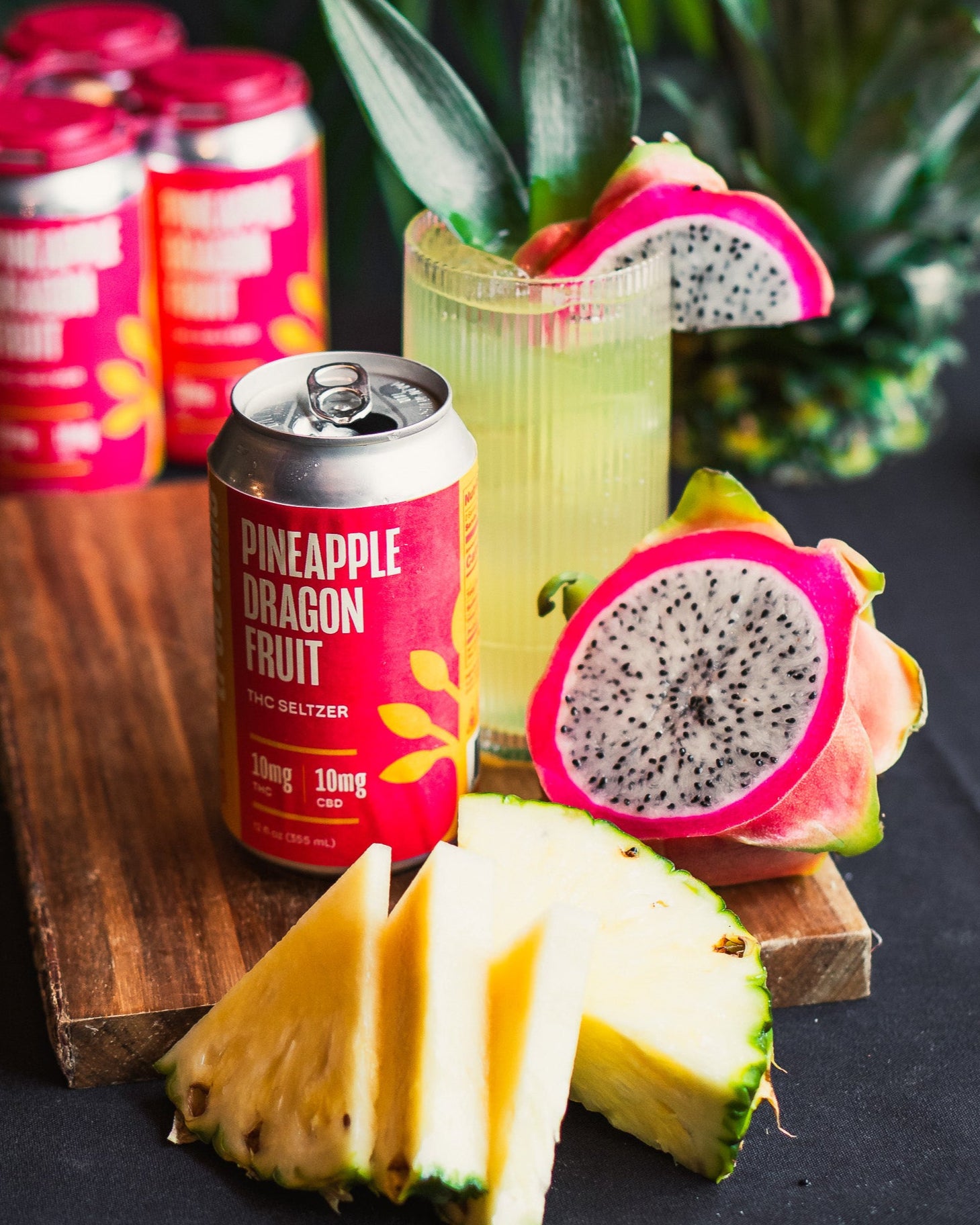 Tree Time Pineapple Dragon Fruit THC seltzer with cocktail, pineapple slices, and dragon fruit – sparkling hemp drink with 10mg THC and CBD.