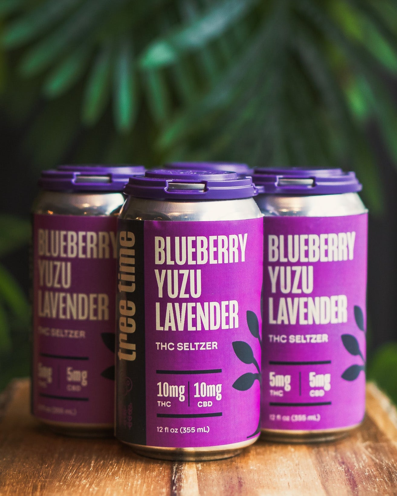 4-pack of Tree Time Blueberry Yuzu Lavender THC seltzers – low-dose sparkling hemp drinks for mindful relaxation.